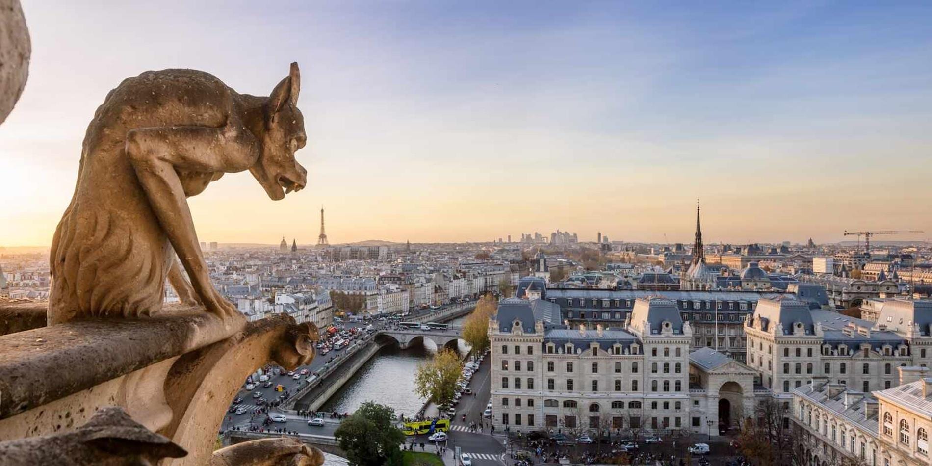Statue overlooking high above the city of Paris