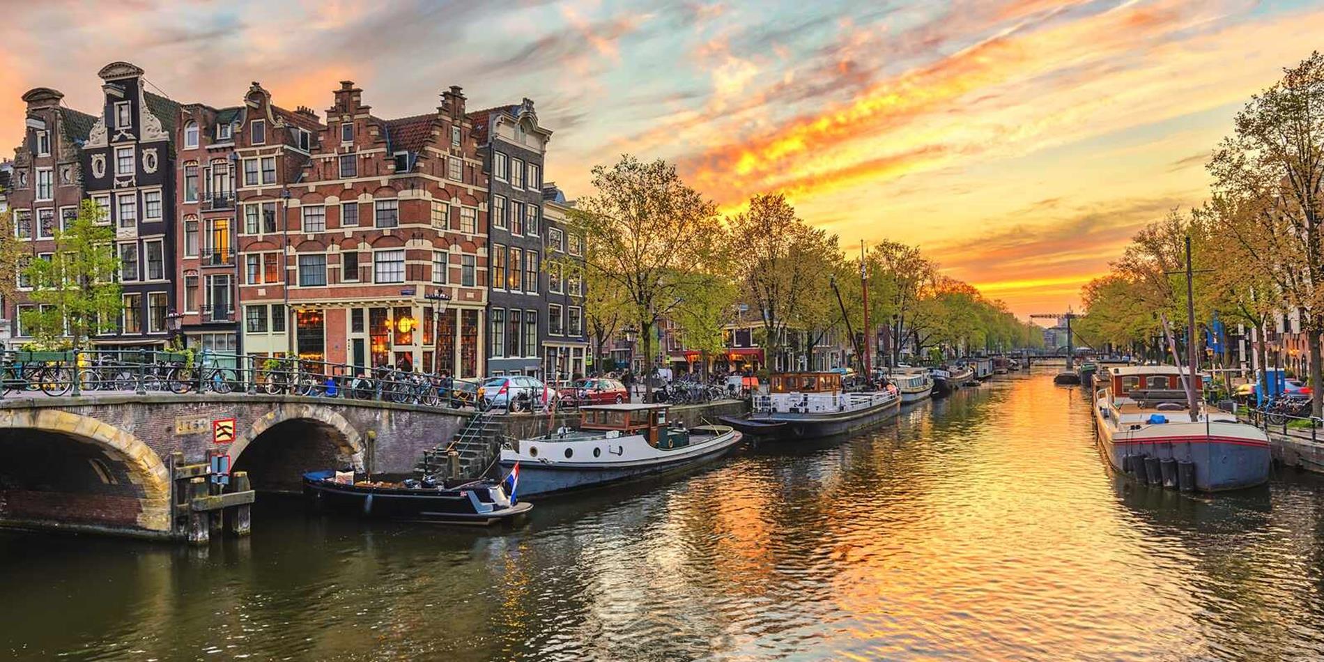 Sun setting over the canal waterfront in Amsterdam
