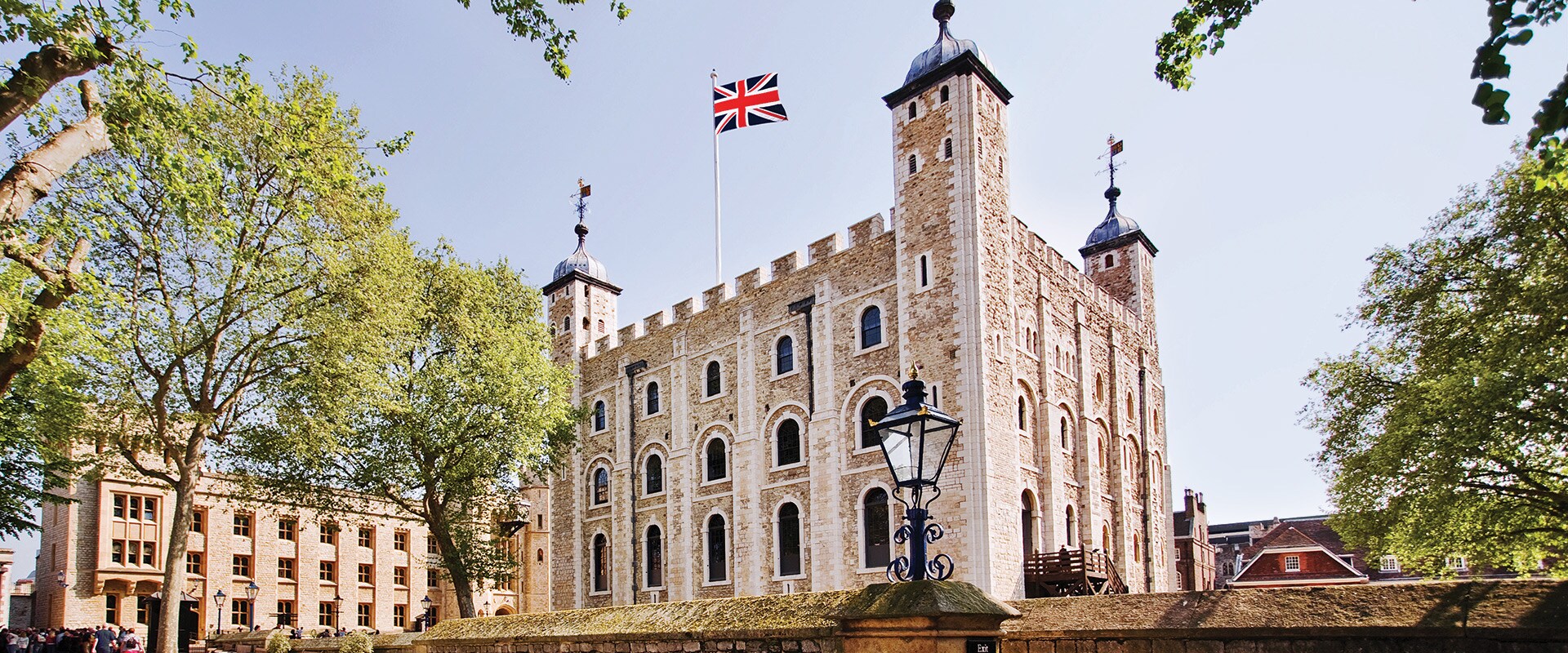 Tower of London with flag flying in the wind.